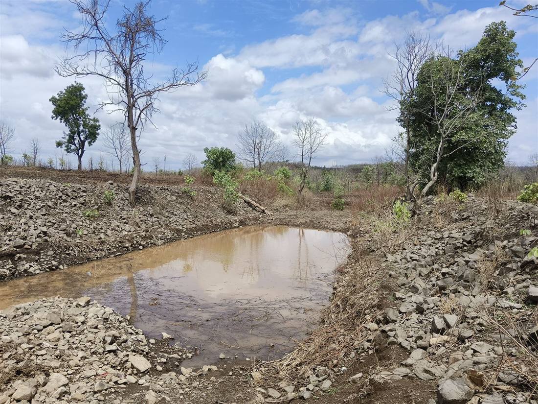 A recharge structure holding water after the first monsoon rains