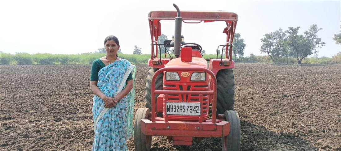 A woman farmer with Custom Hiring Centre machinery